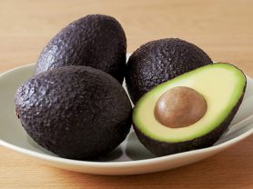 Bowl with 3 full avocados and one cut in half