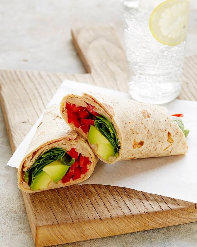 White bean avocado snack wrap cut in half